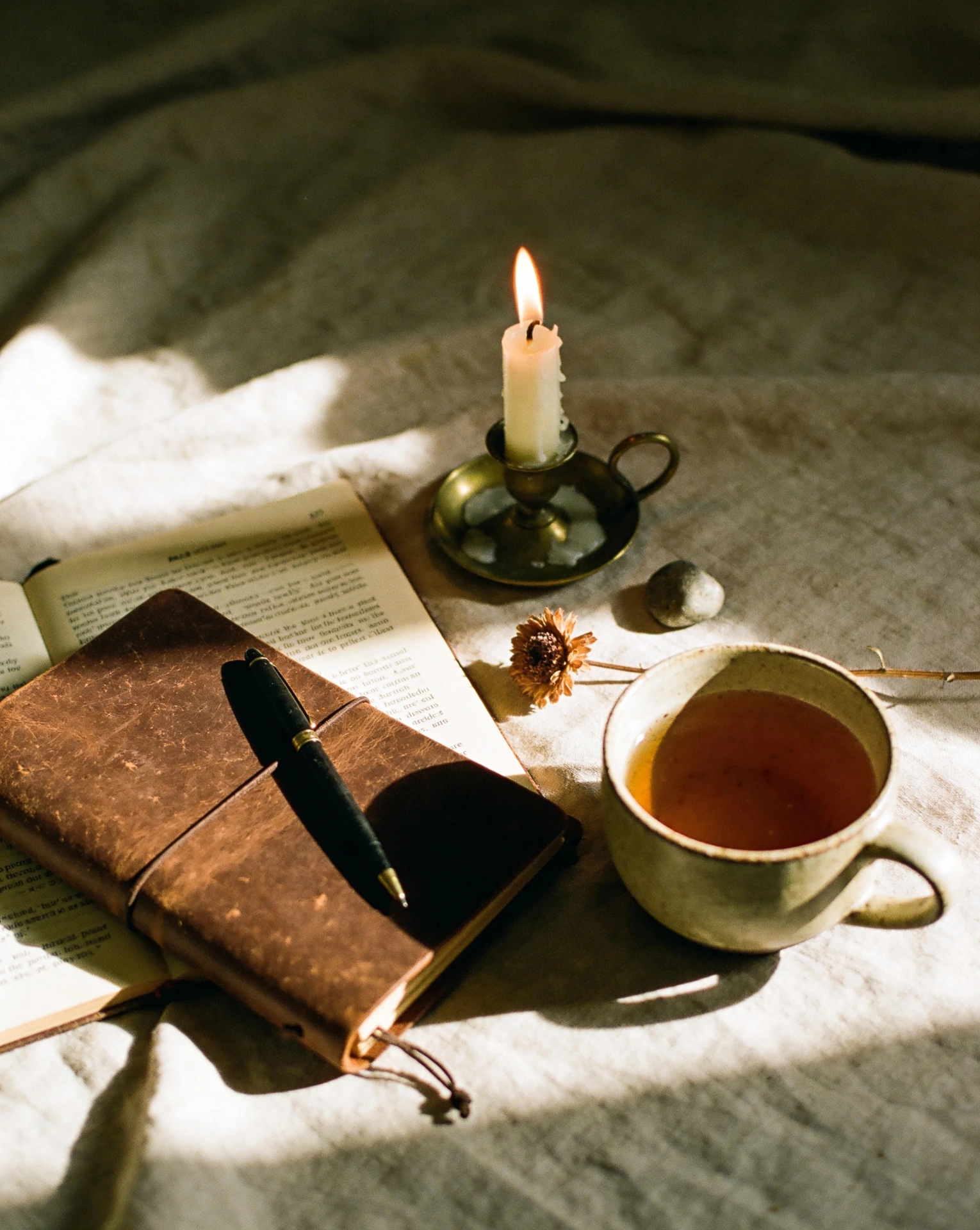 The Surrender Sequence — journal, candle, and coffee